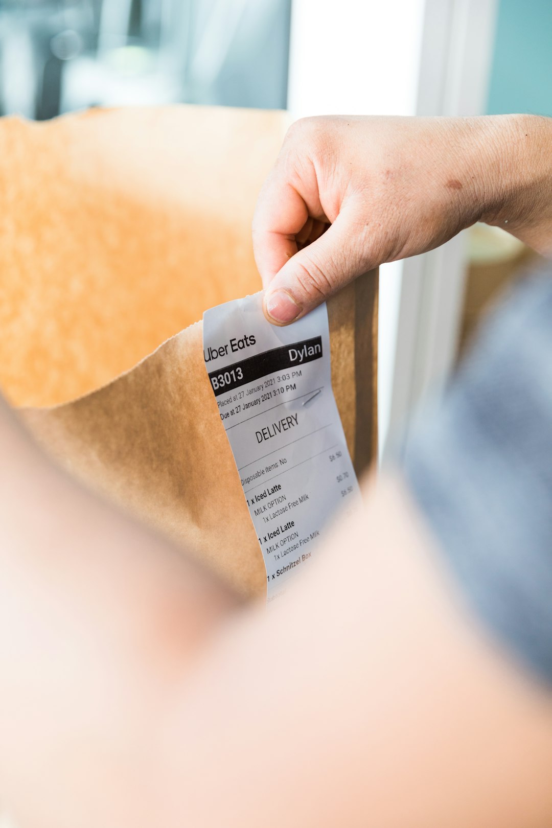 person-holding-white-and-black-tag-vkbqctqizeg